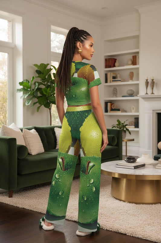 Woman in a green and brown patterned outfit standing in a living room.