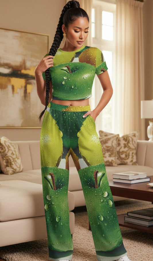 Woman wearing a green and white outfit with a snake in a living room.