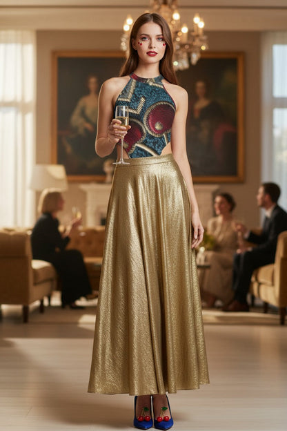 Woman in a stylish outfit holding a glass in an elegant room with people in the background
