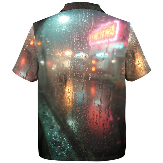 Shirt with a city street scene printed on it, featuring lights and raindrops.